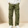 Detailed view of men's olive green cargo pants with multiple utility pockets and relaxed fit. - S / Army Green