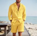 Detail shot of men's yellow linen long sleeve shirt and shorts set on beach boardwalk background. - S / Top And Bottom / Yellow