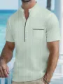 Close-up view of the green and white striped men's henley shirt with contrast pocket detail. - Green Stripe
