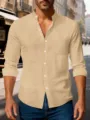 Detailed close-up view of the casual beige linen shirt with stand collar and long sleeves. - Khaki