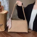 Woven underarm shoulder bag for women, chic beige handbag with polka dot ribbon accessory. - Khaki