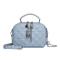 Light blue quilted crossbody bag featuring a metal chain strap and cute silver bear charm. - Blue
