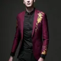 Closeup of men burgundy suit jacket with gold floral print, elegant slim fit fashion detail. - M / Tops / Red