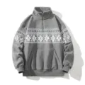 Close-up detail of the grey fleece half-zip sweatshirt featuring winter snowflake print. - M / Tops / Gray