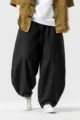 Men's loose Chinese style harem pants detail showing breathable cotton linen fabric. - M / Bottoms / Black