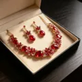 Elegant bridal jewelry set featuring red crystals and necklace in a black gift box. - Gorgeous Bridal Necklace Earring Set / Red (YZ001)