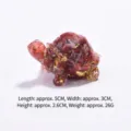 Decorative red resin turtle figurine with gold leaf and natural crystal chips, 5cm length - Red jasper turtle