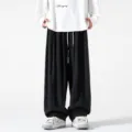 Pantalones casuales anchos para hombre estilo retro japonés color sólido cordón baggy. - M / Negro