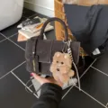 Dark brown PU leather crossbody bag with cute plush puppy keychain for women stylish daily use - Coffee
