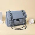 Grey quilted chain shoulder bag for women, stylish crossbody bag with chain lock. - Blue