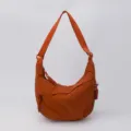 Orange nylon dumpling crossbody bag, casual everyday hobo shoulder bag, lightweight style. - Orange