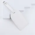 Blank white leather luggage tag for travel suitcase with silver metal buckle detail - White