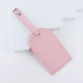 Pink leather luggage tag with metal buckle, durable travel suitcase label for easy identification. - Pink