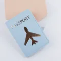Copertina per passaporto in pelle PU azzurra con design d'aereo dorato, porta documenti. - Azzurro