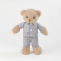 Detailed close-up view of brown plush teddy bear wearing grey polka-dot pajamas soft - Brown / Standing Height 35cm
