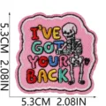Embroidered skeleton patch detail close-up, colorful lettering design, pink cloth badge. - Skull Letter Style (W34ZM-11-05)