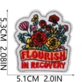 Detailed embroidered floral patch with inspirational recovery lettering, premium craft badge. - Floral Slogan Style (W34ZM-125-06)