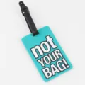 PVC luggage tag, bright teal bag identifier with funny text, durable travel accessory. - Cyan