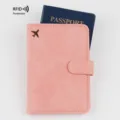 Pink PU leather passport holder with RFID blocking, magnetic closure and cute airplane design. - Magnetic Clasp Style (240907-1) / Pink-1