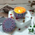 Scented soy wax candle in decorative tin jar with dried flowers and lid for home decor. - H14 Lavender