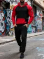 Dettaglio di un elegante completo tuta sportiva da uomo con felpa con cappuccio colorblock. - Taglia S / Top e Pantaloni / Nero rosso