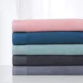 Stack of soft cotton bath towels in multi colors, neat folded presentation, main product view. - 150x72cm / Multicolor