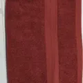 Serviette de visage en coton uni avec bord tissé double, textile doux et absorbant. - Bordeaux