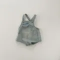 Infant denim romper detail showing classic bib, small front pocket and metal buttons design. - 66cm / Light Blue