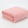 Pink cotton bath towel with textured wave design, soft absorbent bathroom essential. - Sakura Pink