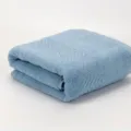 Soft cotton bath towel in light blue with textured chevron border, perfect for daily home use. - Ultramarine
