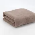 Pure cotton bath towel variant in taupe color with woven zigzag texture pattern design. - Camel