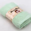 Green pure cotton face towel rolled with belly band packaging for soft daily facial cleansing use. - Sage Green