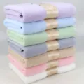 Soft absorbent cotton bath towel variant in multiple vibrant pastel colors stacked neatly. - Mixed Colors
