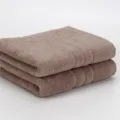 Dickes einfarbiges Handtuch Set ordentlich gefaltet flauschig saugstark fuer den Alltag - 75x33 cm / Camel