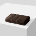 Brown cotton hand towel, soft absorbent face wash cloth for daily home bathroom use. - Coffee