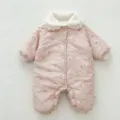 Detailed view of baby winter padded romper featuring floral print, cozy fleece collar and buttons. - 66cm / Light Pink