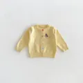 Detailed view of baby knitted cardigan featuring cute dachshund embroidery and colorful buttons. - 73cm / Tops / Milk Yellow