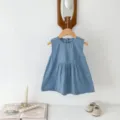 Infant denim sleeveless dress detail, soft fabric texture, lifestyle hanging shot setup. - 66cm / Skirtless Dress