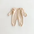 Adorable baby knitted romper detail, featuring cute ruffles and wooden buttons for cozy autumn. - 66cm / Apricot