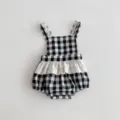Cute black and white gingham baby romper with delicate lace trim, perfect for summer infant wear. - Black White Grid
