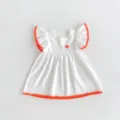 White baby girl dress with orange pom-pom trim and flutter sleeves. Cute summer toddler outfit detail. - 73cm / White Skirt