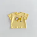 Detailed view of baby yellow short sleeve t-shirt featuring cute lion patch and letter print. - 66cm / Yellow