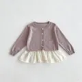 Detailed view of toddler girl knit cardigan, hollow pattern, button front, ruffle hem detail. - 66cm / Tops / Purple