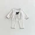 Sweet baby girl 3-piece set featuring polka dot camisole, ruffled long sleeve top and pants. - 66cm / Set / White