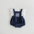 Detailed view of baby girl cute dark blue romper with white lace sleeves and embroidery. - 73cm / Set