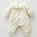 Cozy quilted baby romper in creamy white, featuring a sweet chest bow and soft fleece lining. - 66cm / Light Apricot