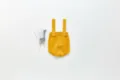 Detail shot of infant knitted strap romper, solid yellow baby jumpsuit, cute buttons and straps. - 66cm / Mustard Yellow