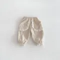 Cute toddler girls corduroy pants with delicate white lace ruffles, casual cuffed long trousers. - Apricot / 66cm