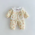 Detailed view of baby girl quilted winter romper featuring cute floral pattern and lace collar. - 66cm / Yellow