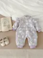Detailed view of the cute baby winter floral rabbit romper with cozy padded lining and ruffles. - 66cm / Purple